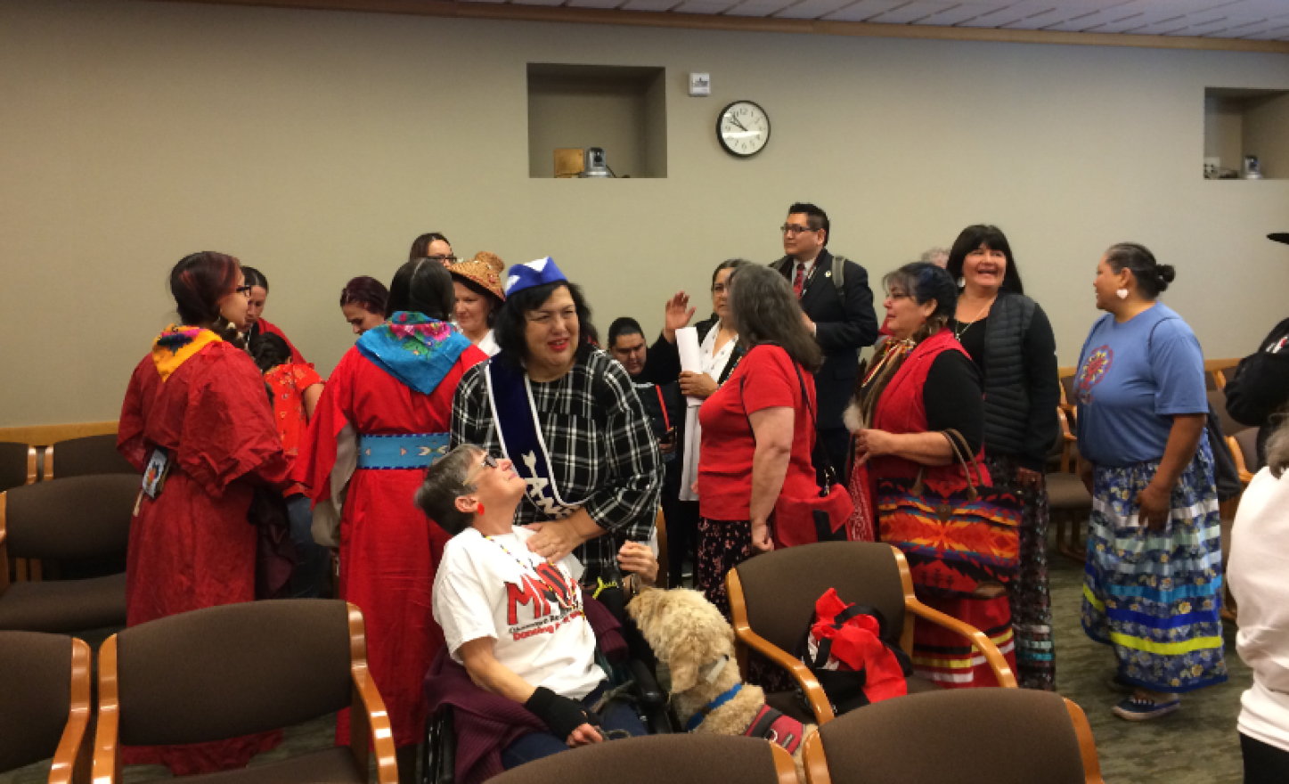 A group of Native American women mingle after testimony concluded on House Bill 2625.